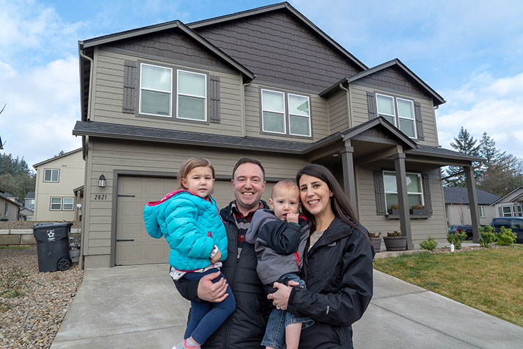 2018 Hayden Homes Backyard Giveaway Winners in front of their house