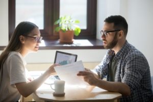 Young couple working on budgeting for their new home