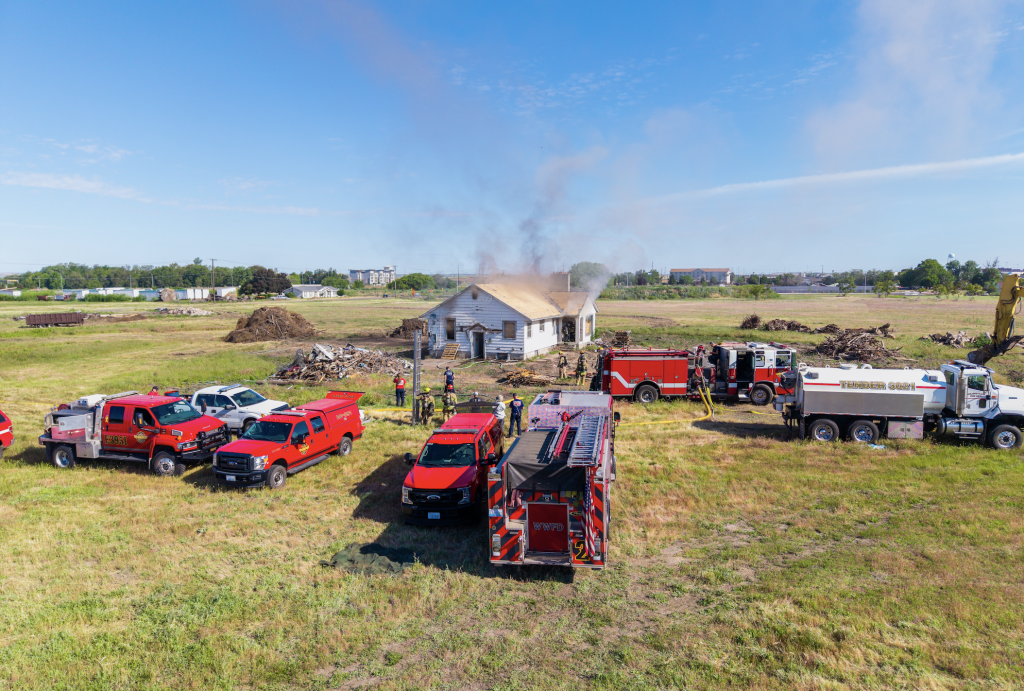 Firefighters gather at The Equinox community for the Hayden Homes fire department partnership live-fire training.