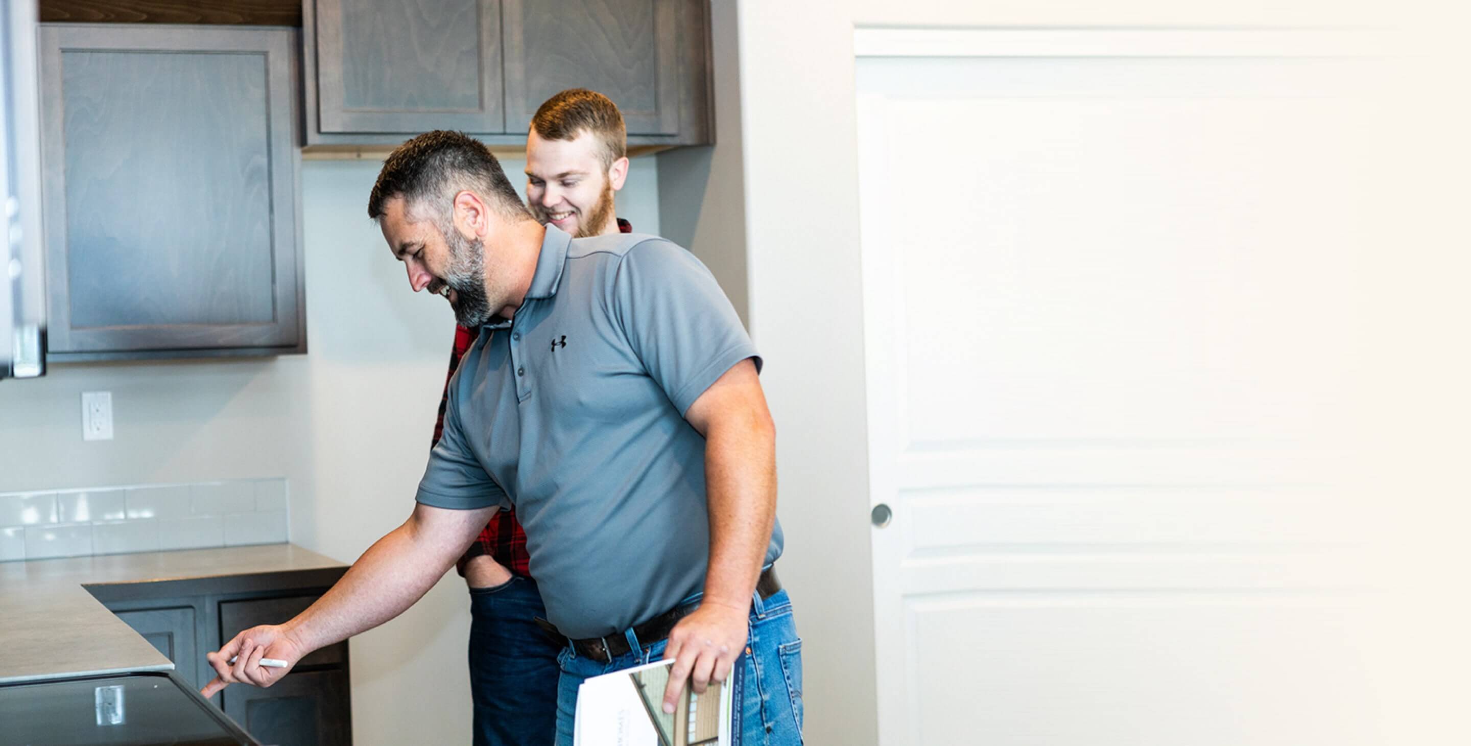 Home inspector inspecting home with client